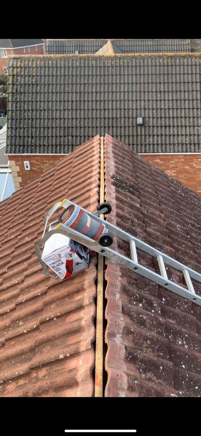 Dry ridge kit and roof ladder in place with the old mortar bedded ridge tiles lifted off