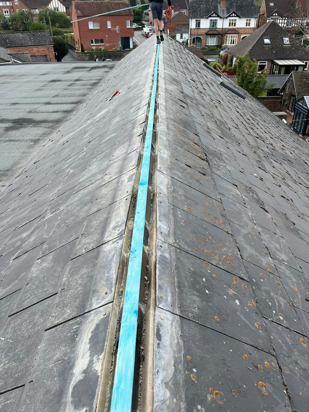 Ridge stripped back to a new batten with the breather strip laid ready for the ridge tiles
